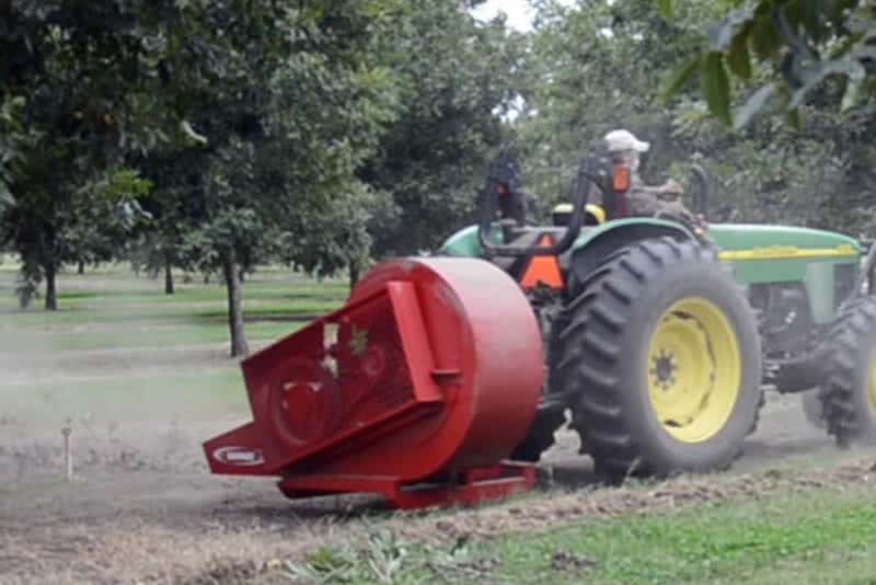 A trailer mounted pecan huller and cleaner